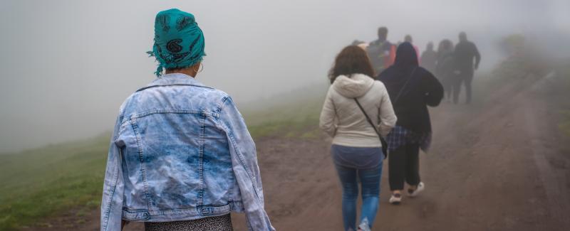 image of people walking along a road